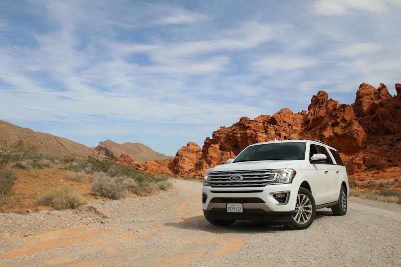 SUV on the road for an airport transfer